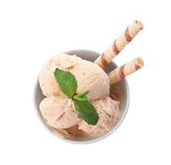 Bowl with caramel ice cream on white background