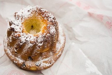 Traditional Alsace regional Kugelhopf bundt cake on white background with copy space