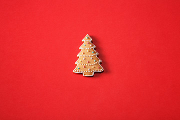 Gingerbread tree on a red background. The basis for the design of the poster or postcards. It is possible to cut at a square, horizontal or vertical format.