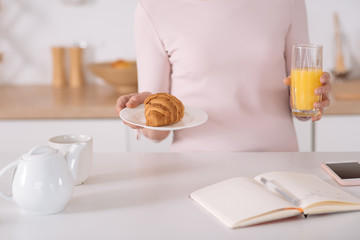 Senior nice woman preparing breakfast for you