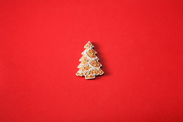 Gingerbread tree on a red background. The basis for the design of the poster or postcards. It is possible to cut at a square, horizontal or vertical format.