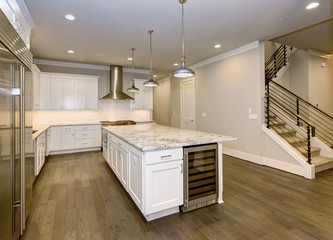 Large, spacious kitchen design with white kitchen cabinets