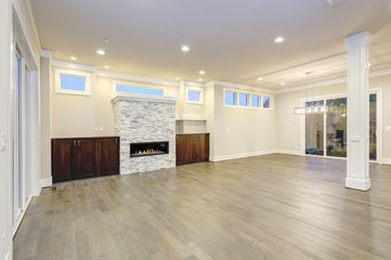 Spacious empty living room interior in white and gray colors.