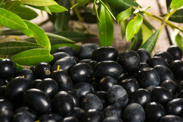 Olives on wooden background