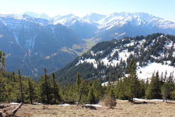 Landscape of snowy Alp mountains with forests, taken from Alpspitz peak in Gaflei village in the municipality of Triesenberg in Principality of Liechtenstein.
