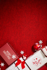 Christmas gift box.  Christmas presents in red boxes at red table.