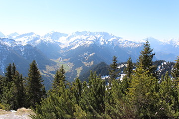 Landscape of snowy Alp mountains with forests, taken from Alpspitz peak in Gaflei village in the municipality of Triesenberg in Principality of Liechtenstein.