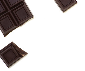 Broken chocolate bar isolated on white