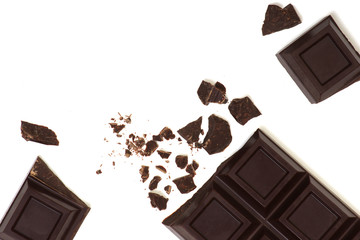 Broken chocolate bar isolated on white