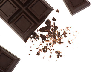 Broken chocolate bar isolated on white