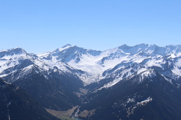 Fototapeta na wymiar Landscape of snowy Alp mountains with forests, taken from Alpspitz peak in Gaflei village in the municipality of Triesenberg in Principality of Liechtenstein.