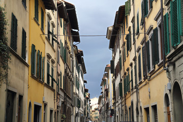Fototapeta na wymiar Historical houses in a street in Florence, Italy