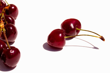Cherry. Cherries in white bowl. Cherry on white background.