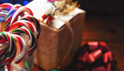 Christmas still life. homemade ginger biscuits, cane candy, on a wooden background.