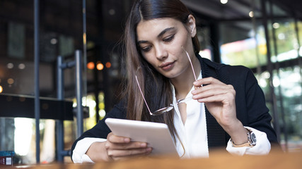 Young woman using digital tablet