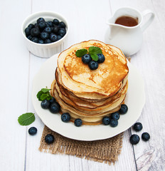 Plate with pancakes and blueberries