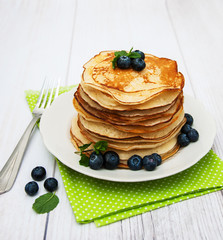 Plate with pancakes and blueberries