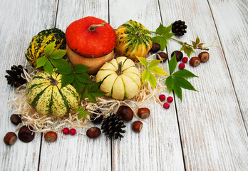 Pumpkins with autumn leaves