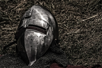 knight helmet with mail armour on the grass