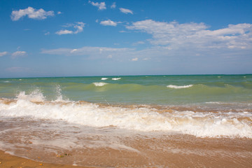 Adriatic Sea coast view. Seashore of Italy, summer sandy beach with clouds on horizon.