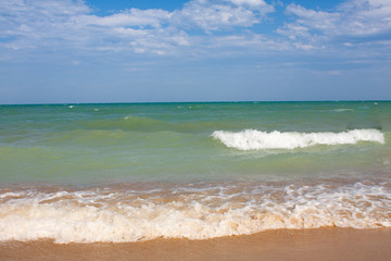 Adriatic Sea coast view. Seashore of Italy, summer sandy beach with clouds on horizon.