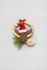 Christmas deer / Creative concept photo of a deer made of paper on white background.