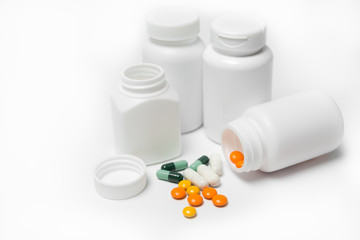 Medicine bottle and medicine on a white background