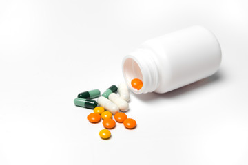 Medicine bottle and medicine on a white background