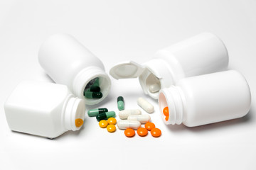 Medicine bottle and medicine on a white background