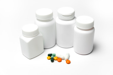 Medicine bottle and medicine on a white background