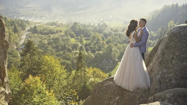 Romantic couple kissing in their wedding day