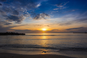 Panoramic views of the sunrise with spectacular sky over the sea.