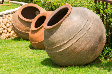 clay amphorae on the lawn