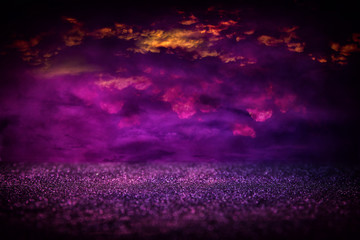 Purple glitter lights background. defocused.