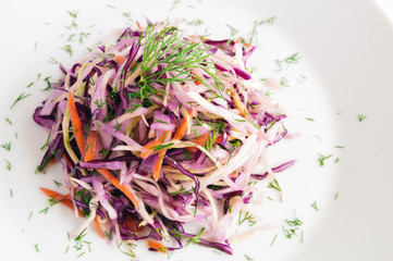 fresh winter salad of cabbage decorated with dill and dressed with olive oil