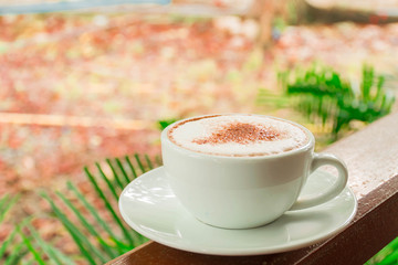delicious hot coffee in the green garden, coffee cup