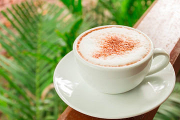 delicious hot coffee in the green garden, coffee cup