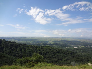 Obraz premium North Caucasus. the mountains. rocks. green Forest. blue sky. clouds. nature. summer. journey. tourism. 