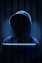 Computer Hacker Committing Cyber Crime Concept with High Tech Background and Copy Space