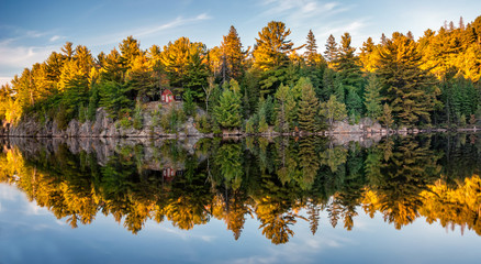 Autumn fall colours reflecting in lake - obrazy, fototapety, plakaty