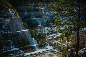 Inside of an abandoned quarry, which is located in the forest
