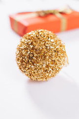 Golden christmas ball and box with gift