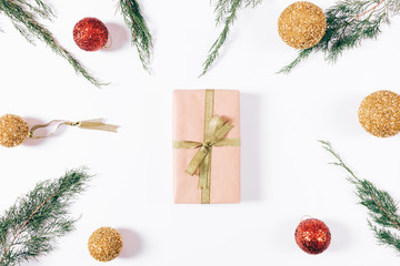 Box with gift and gold ribbon and Christmas decorations