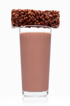 Glass of chocolate breakfast milk with choc cereal