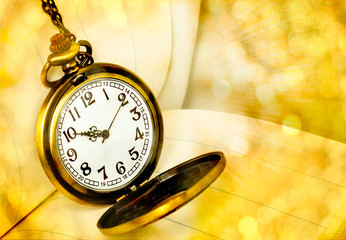 Vintage pocket watch with bokeh background