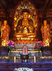 Toned image Golden Buddha statue sitting in lotus position