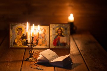 burning candle in a dark room, orthodox