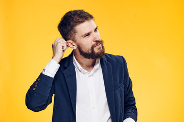 Business man thinking, business man with a beard, business man on a yellow background