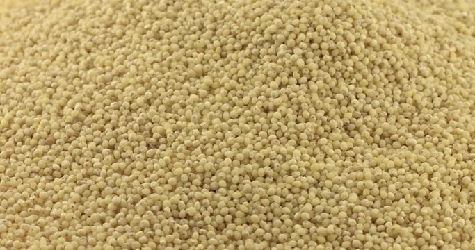 Close up of dry spilled millet rotating