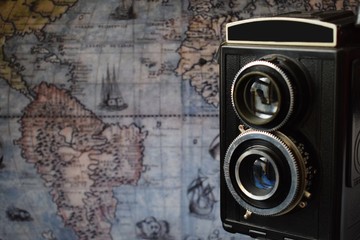 old camera, retro camera, vintage, with the old world map in the background